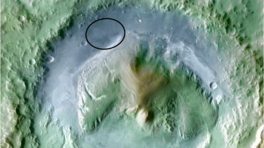 MÅLET: Et lite område i bunnen av Gale-krateret på Mars (innringet). Terrenget er vanskelig og landingen blir den mest presisjonskrevende i Mars-utforskningens historie. Foto: REUTERS/NASA/JPL/SCANPIX MÅLET: Et lite område i bunnen av Gale-krateret på Mars (innringet). Terrenget er vanskelig og landingen blir den mest presisjonskrevende i Mars-utforskningens historie. Foto: REUTERS/NASA/JPL/SCANPIX