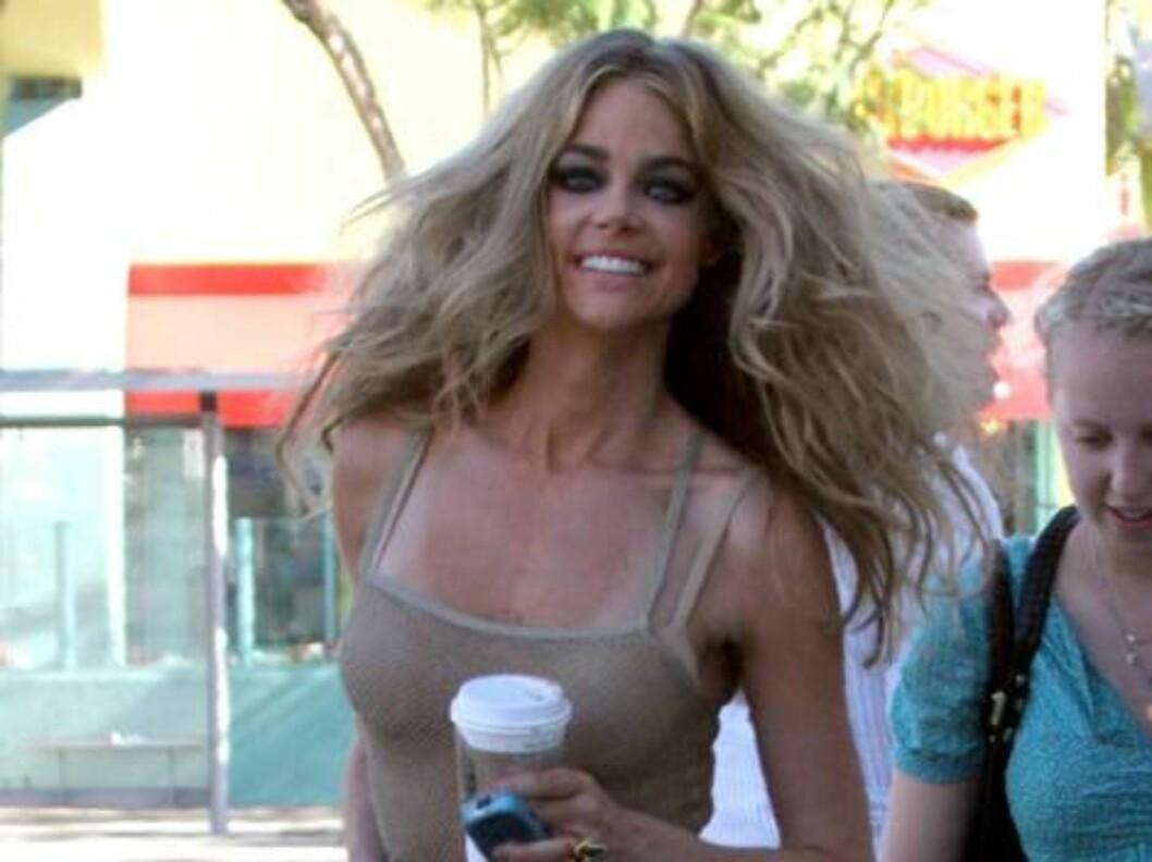 Sexy Denise Richards poses at a gas station in a black bathing suit a photoshoot for an fashion magazine. July 7, 2006 X17agency exclusive Foto: All Over Press Sexy Denise Richards poses at a gas station in a black bathing suit a photoshoot for an fashion magazine. July 7, 2006 X17agency exclusive Foto: All Over Press
