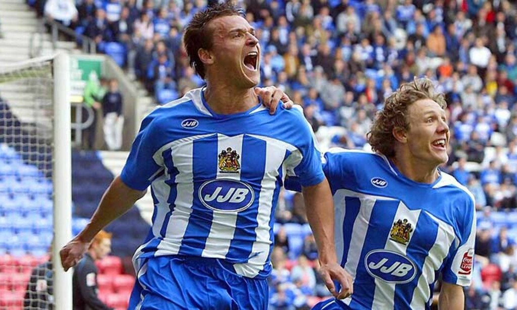 RYKKET OPP I GÅR: Jubelen sto i tribunetaket da Wigan tok steget opp blant de beste. Foto: AP RYKKET OPP I GÅR: Jubelen sto i tribunetaket da Wigan tok steget opp blant de beste. Foto: AP