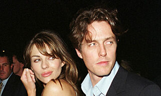 LON06:LONDON,23MAY00 - FILE PHOTO 2AUG99 - Liz Hurley and Hugh Grant stop to be photographed as they arrive at a New York launch party in August 1999. The celebrity couple announced, May 23, that they have decided to 'temporarily split up'. br/Photo by Brad Rickerby REUTERS
