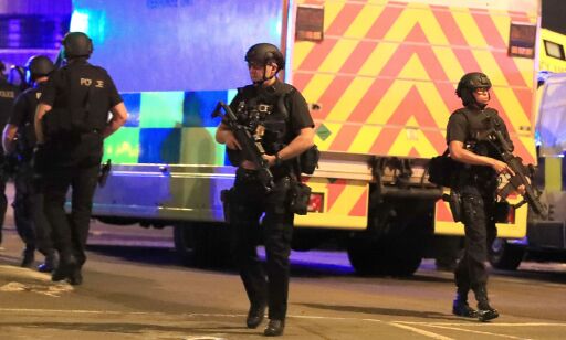 Armed police at Manchester Arena after reports of an explosion at the venue during an Ariana Grande gig.