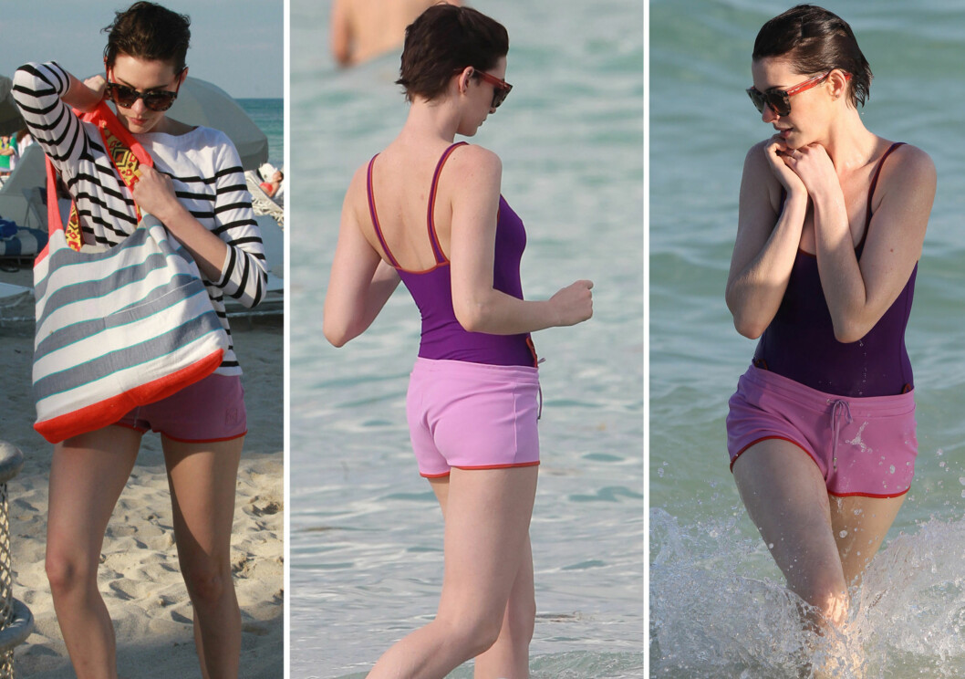 AVSLAPPET STIL: Skuespiller Anne Hathaway går for en komfort og søte bærfarger på stranda, i badedrakt og shorts. Foto: All Over Press AVSLAPPET STIL: Skuespiller Anne Hathaway går for en komfort og søte bærfarger på stranda, i badedrakt og shorts. Foto: All Over Press