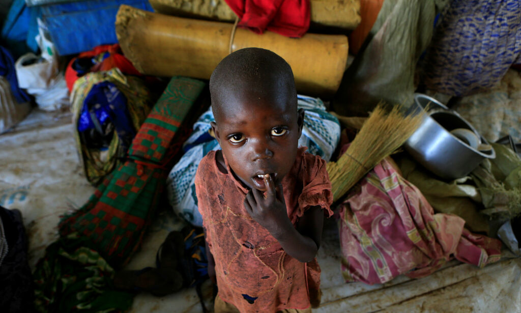 A displaced boy from South Sudan stands next to family belongings in Lamwo after fleeing fighting in Pajok town across the border in northern Uganda April 5, 2017. REUTERS/James Akena TPX IMAGES OF THE DAY