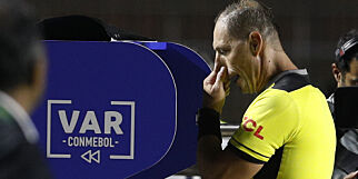 Referee Nestor Pitana looks at the VAR before awarding a penalty kick for Brazil during a Copa America Group A soccer match against Bolivia at the Morumbi stadium in Sao Paulo, Brazil, Friday, June 14, 2019. (AP Photo/Victor Caivano)