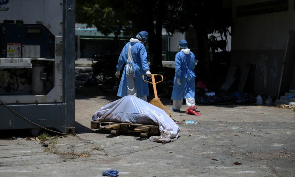 CLEANER: Health workers clean the streets of Ecuador. Photo: REUTERS / Vicente Gaibor del Pino 