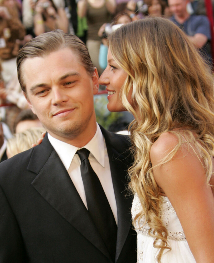 SJOKKERTE: Da DiCaprio tok med Bündchen på Oscar-utdelingen i 2005, gikk blitslampene til fotografene av uten stopp. Samme år gikk de for øvrig fra hverandre. Foto: NTB Scanpix SJOKKERTE: Da DiCaprio tok med Bündchen på Oscar-utdelingen i 2005, gikk blitslampene til fotografene av uten stopp. Samme år gikk de for øvrig fra hverandre. Foto: NTB Scanpix