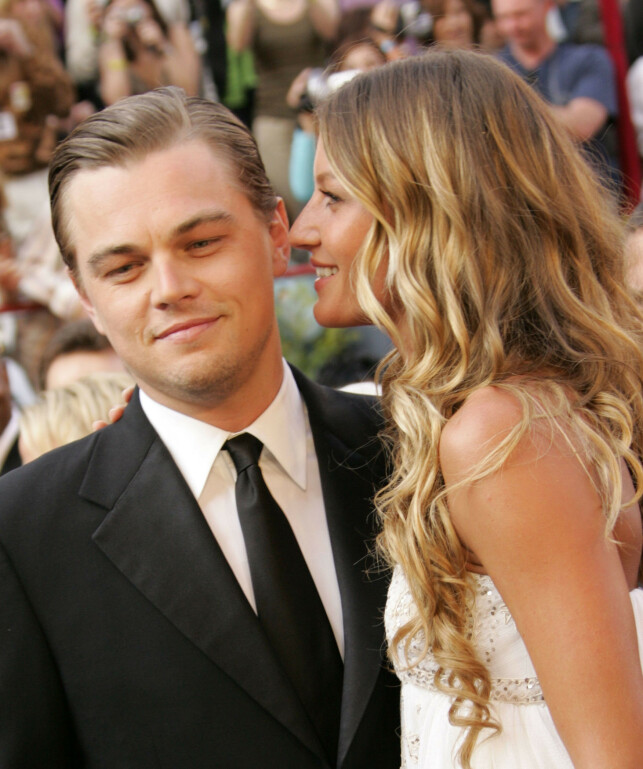 SJOKKERTE: Da DiCaprio tok med Bündchen på Oscar-utdelingen i 2005, gikk blitslampene til fotografene av uten stopp. Samme år gikk de for øvrig fra hverandre. Foto: NTB Scanpix SJOKKERTE: Da DiCaprio tok med Bündchen på Oscar-utdelingen i 2005, gikk blitslampene til fotografene av uten stopp. Samme år gikk de for øvrig fra hverandre. Foto: NTB Scanpix